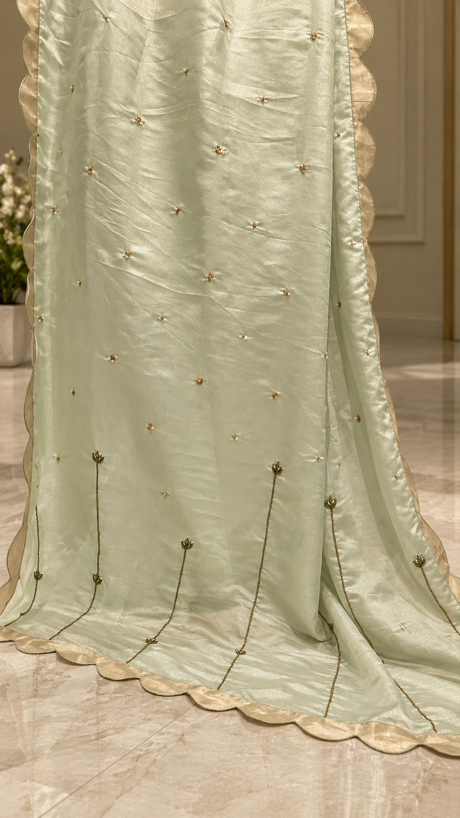 Sage green matching dupatta gold floral details closeup